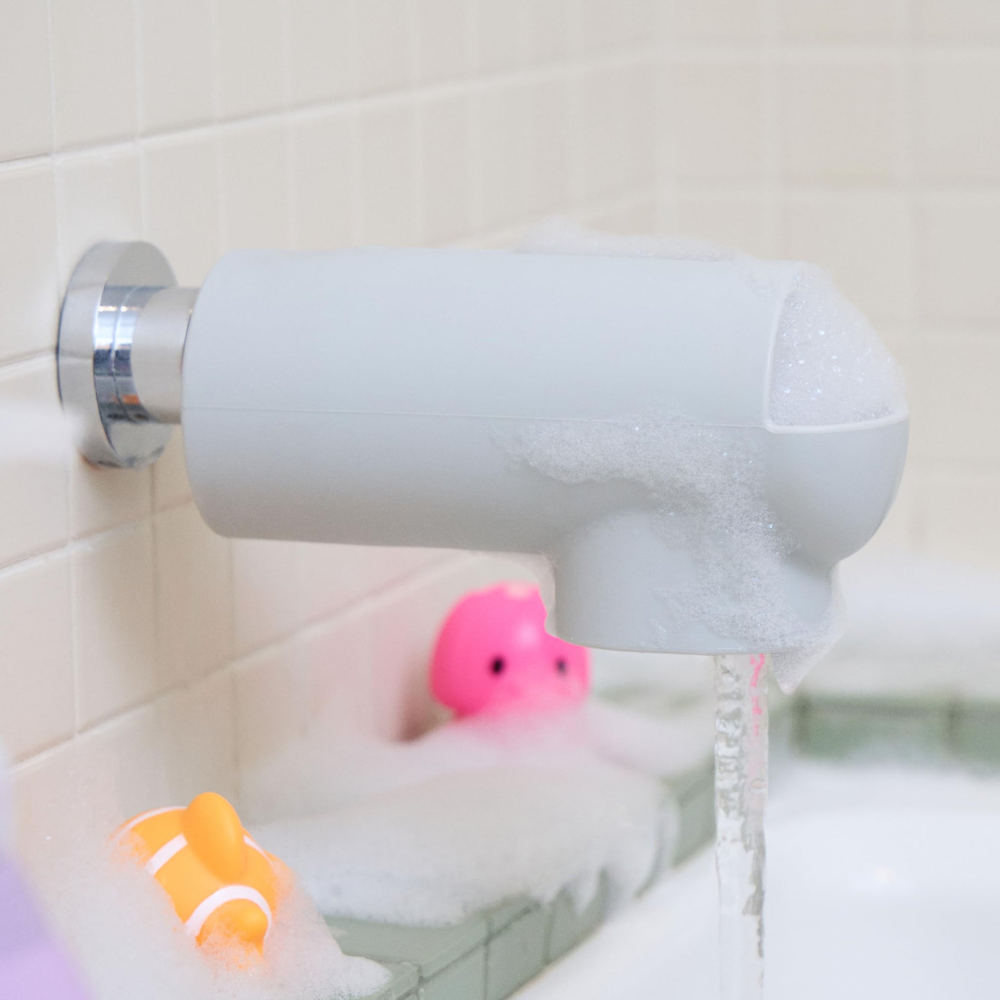 Munchkin® Soft Spot™ Bath Spout Cover for Baby, Bathtub Guard with Built-in Bubble Bath Dispenser, Silicone, Grey