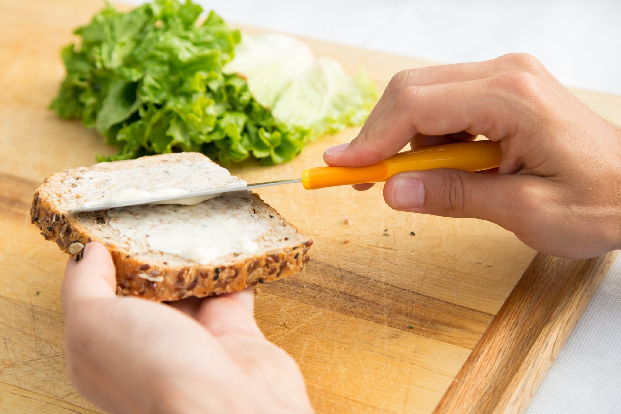 Zyliss Sandwich Knife & Condiment Spreader - Sandwich Spreader Knife for Butter, Cream Cheese, & Jellies - Butter for Bagels & Toast - Orange